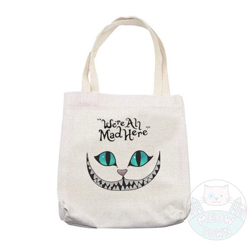 ’We’re All Mad Here’ Lovely, durable, beige tote bag printed in the UK by us at Meow Town, exclusively for You. Natural beige colour. Purrrfect bag for any occasions all year round. It can also be a beautiful gift idea for the cat lover in your life.