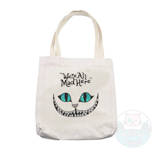 ’We’re All Mad Here’ Lovely, durable, beige tote bag printed in the UK by us at Meow Town, exclusively for You. Natural beige colour. Purrrfect bag for any occasions all year round. It can also be a beautiful gift idea for the cat lover in your life.