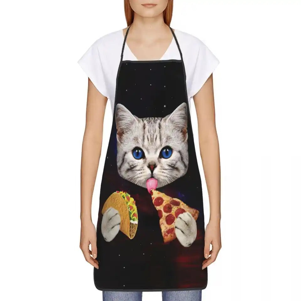 If you like cooking and baking, and you are a crazy cat lover, then a cat apron is a MUST have accessory for you. This cute apron has a tabby kitty with pizza and taco print, on black background.