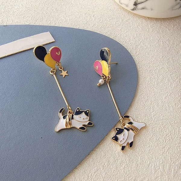 Adorable earrings with a cute kitty flying with a colourful balloon. Lovely gift idea for cat lovers.