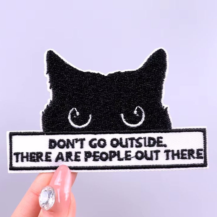 iron-on black cat patch don't go outside there are people out there