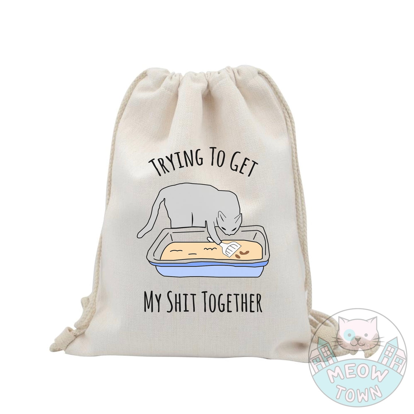 Super cute yet handy tote bag printed in the UK by us at Meow Town exclusively for You. Funny 'Trying to get my shit together’ quote with a kitty cleaning his own litter tray :) Natural beige colour. Durable single layer material. Polyester and cotton fabric, linen effect. Choose from 3 bag types: Classic tote, Large tote or drawstring backpack.