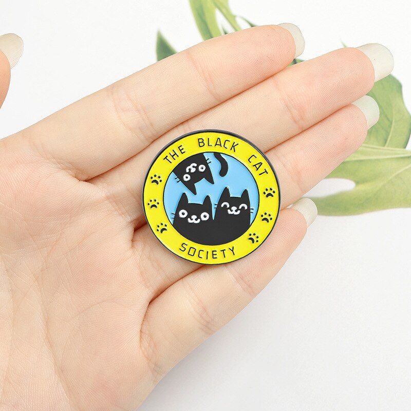 A lovely enamel pin badge for black cat lovers. Black cat society. It can be a purrrfect stocking filler for your friends and family.