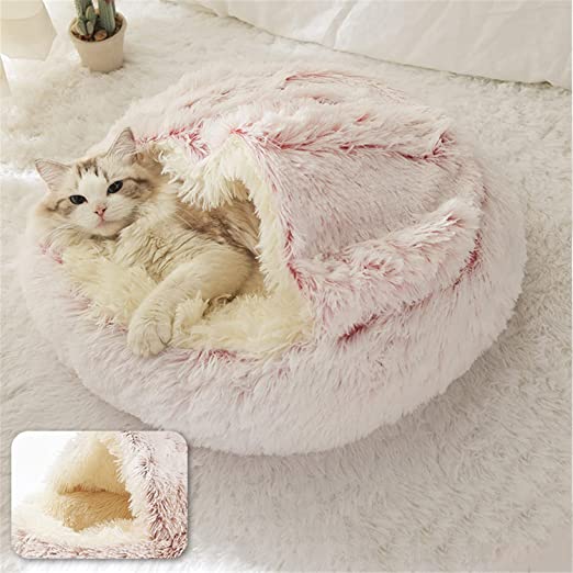 All cats need their own little spaces to hide from time to time. This cosy fluffy bed is a purrfect gift for your furry friend. Super soft and warm. Non-slip bottom. Large size, perfectly enough room for kittens and adult cats as well. Material: Polyester and cotton, long pile plush.