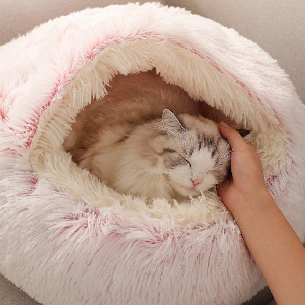 All cats need their own little spaces to hide from time to time. This cosy fluffy bed is a purrfect gift for your furry friend. Super soft and warm. Non-slip bottom. Large size, perfectly enough room for kittens and adult cats as well. Material: Polyester and cotton, long pile plush.