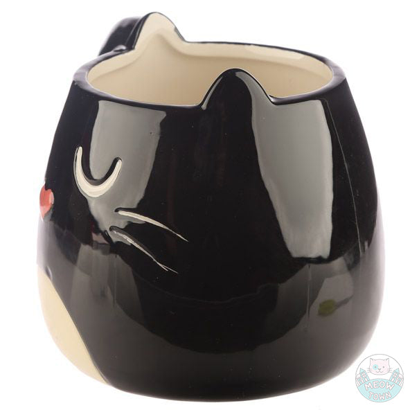 Enjoy your favourite drink from this lovely cat shaped porcelain mug  Black and white colour, fluffy tail and cute cat face with heart shaped nose