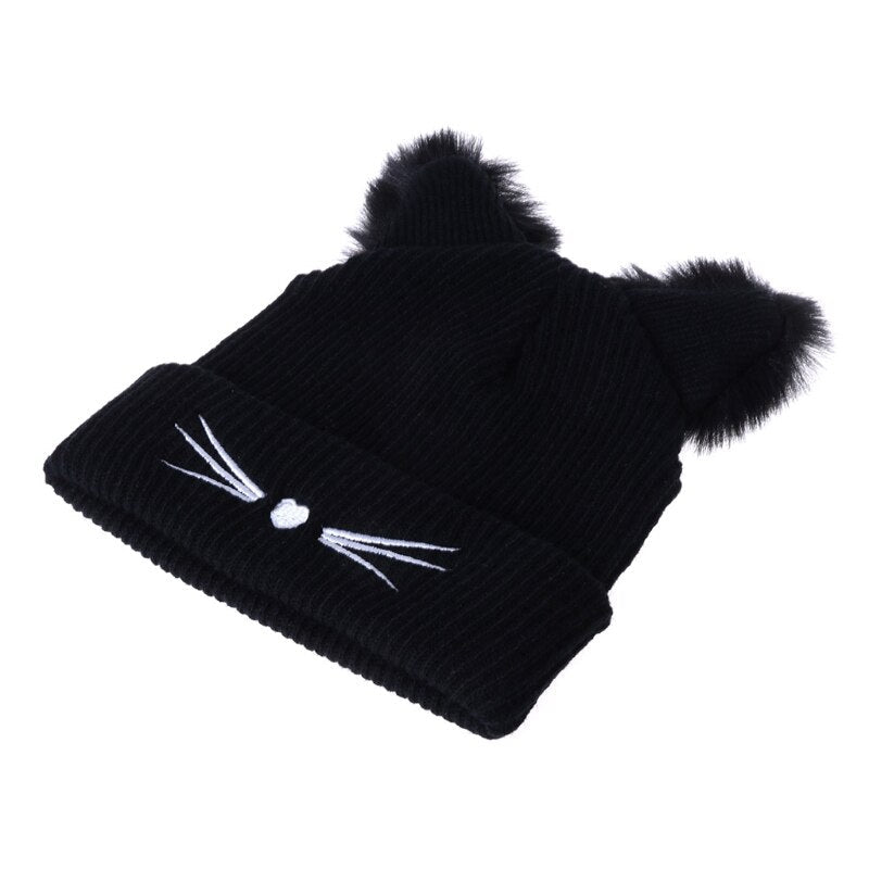Cute, warm knitted hat with fluffy faux fur ears, specifically designed for the cat lover. Embroidered little nose and whiskers. Adults/teens size. Polyester, faux fur material. Suitable for autumn, winter and spring.