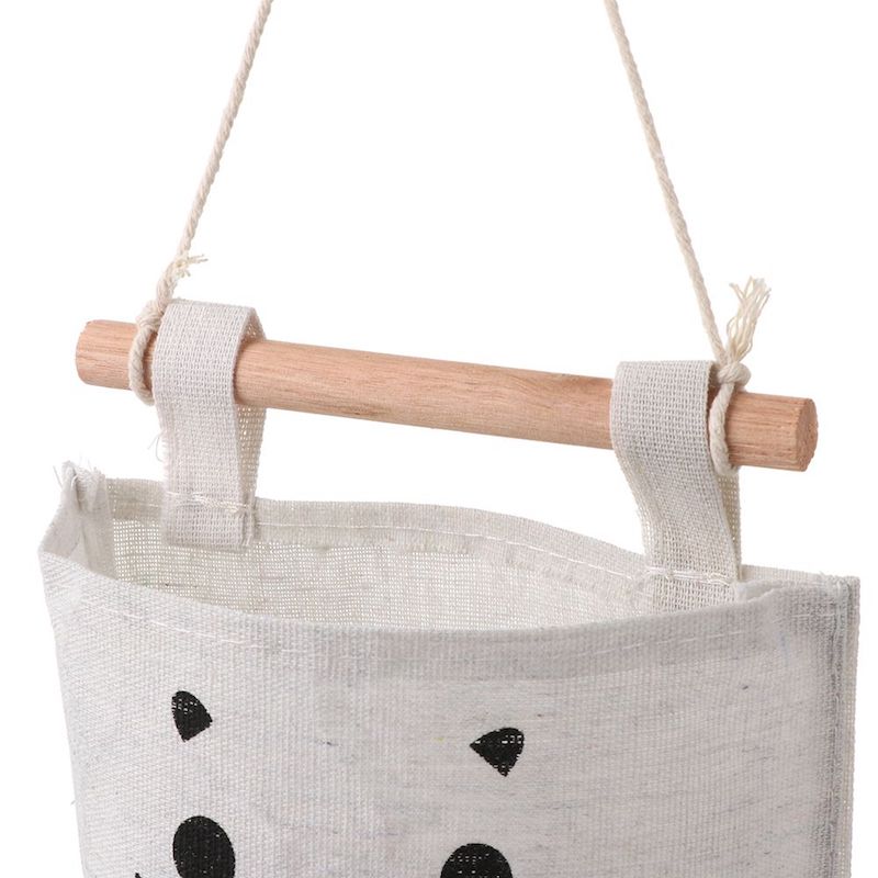 A super cute, small hanging storage bag with adorable printed kitty face to organise your everyday items in your kitchen, diy corner, office and so on.