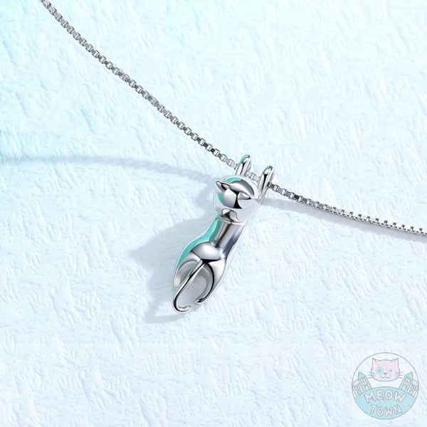 Cute hanging kitten pendant necklace for cat lovers. Silver colour polished jewellery