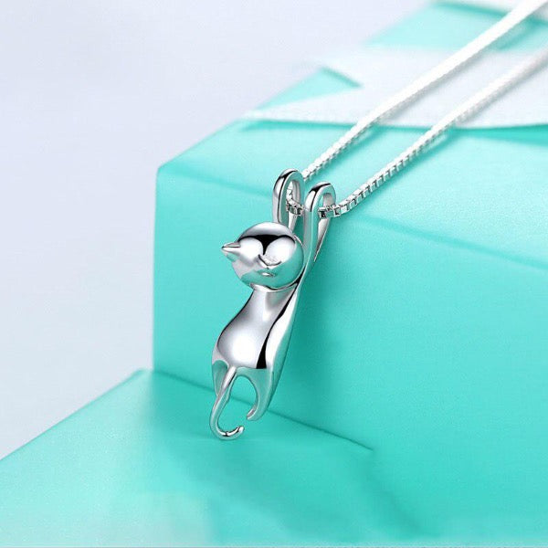 Cute hanging kitten pendant necklace for cat lovers. Silver colour polished jewellery