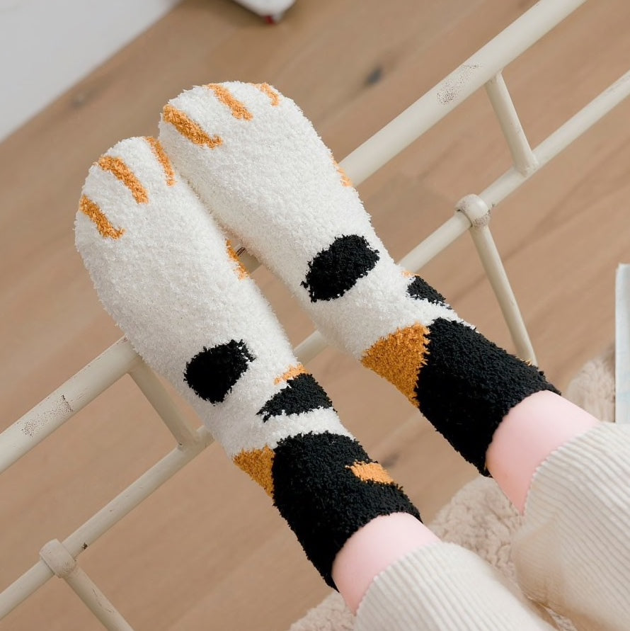 A pair of lovely, warm socks to match your footsies to your little furry friend's paws. Soft and very comfy. One size calico design