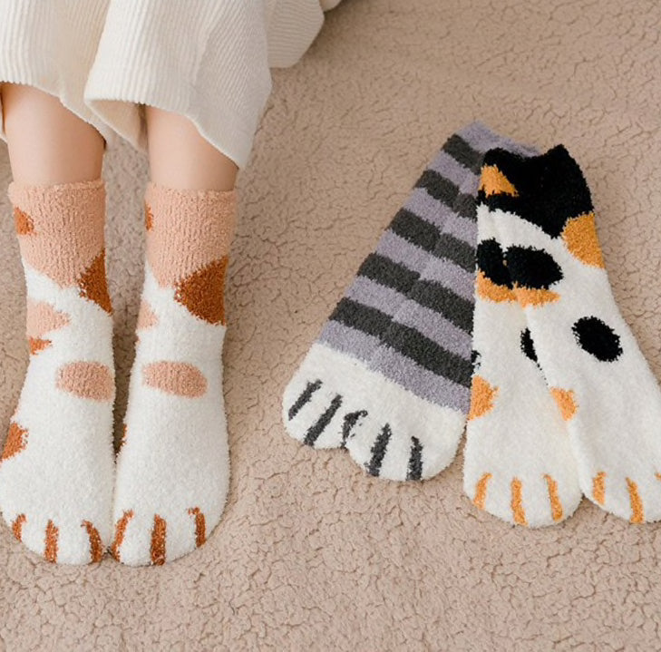 A pair of lovely, warm socks to match your footsies to your little furry friend's paws. Soft and very comfy. One size grey ginger calico patterns