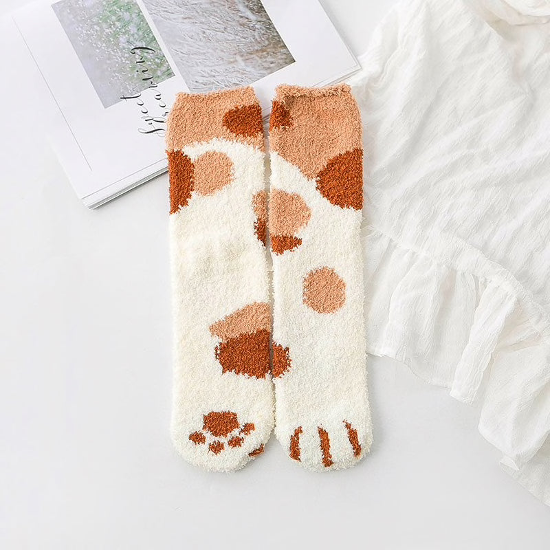 A pair of lovely, warm socks to match your footsies to your little furry friend's paws. Soft and very comfy. One size ginger orange kitty pattern