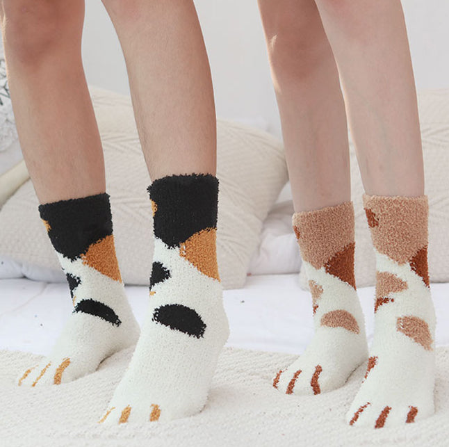 A pair of lovely, warm socks to match your footsies to your little furry friend's paws. Soft and very comfy. One size calico and ginger cat patterns