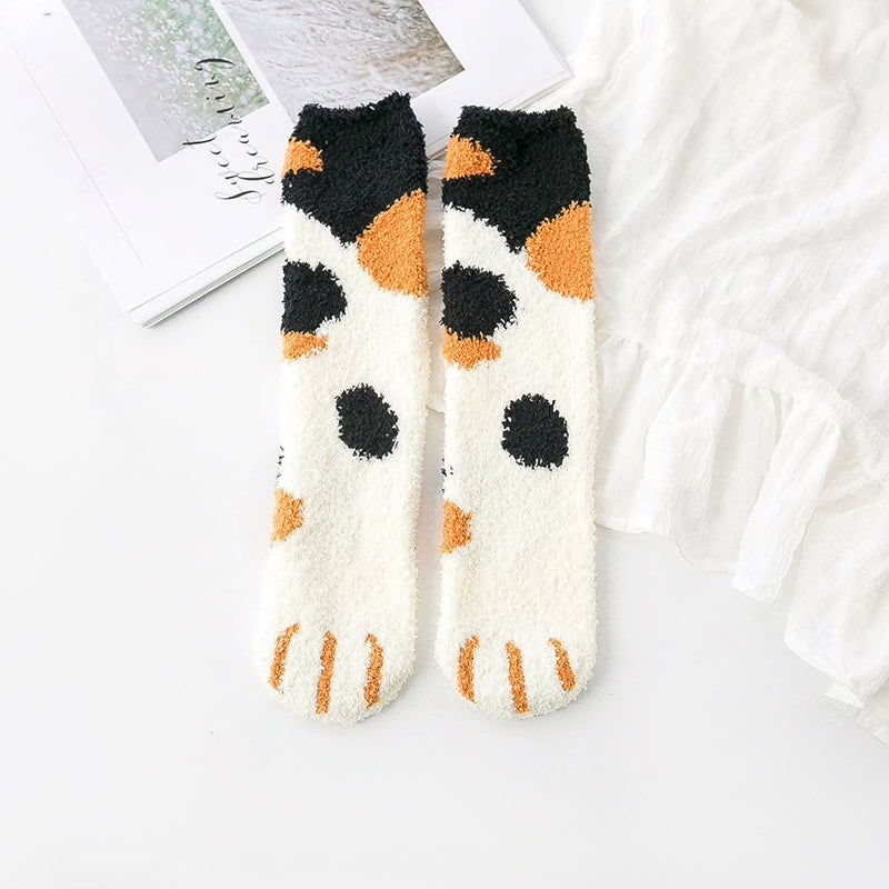 A pair of lovely, warm socks to match your footsies to your little furry friend's paws. Soft and very comfy. One size calico cat pattern