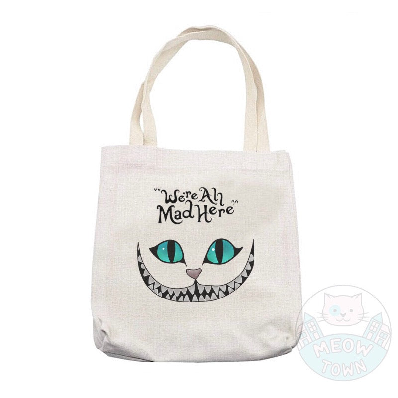 ’We’re All Mad Here’ Lovely, durable, beige tote bag printed in the UK by us at Meow Town, exclusively for You. Natural beige colour. Purrrfect bag for any occasions all year round. It can also be a beautiful gift idea for the cat lover in your life. 