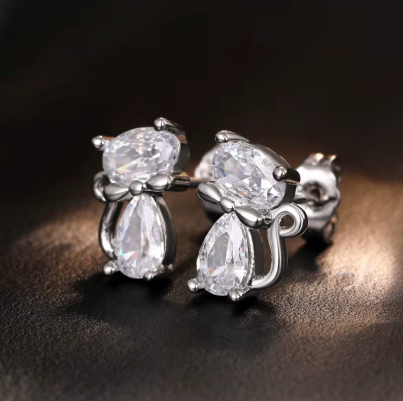 Crystal Cat With Bow Earrings on dark background