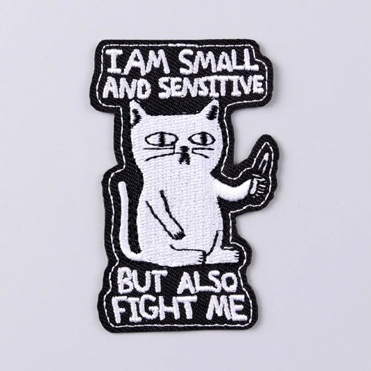 Cute embroidered iron-on cat patch with funny ‘I am small and sensitive but also fight me’ slogan. A perfect way to bring new life to your old garments or to cover small holes or marks with this cute patch!