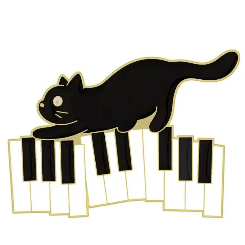 A pawsome enamel pin badge for the music lovers with a cute kitty on the piano.  Perfect stocking filler or cheer me up gift for all cat lovers.