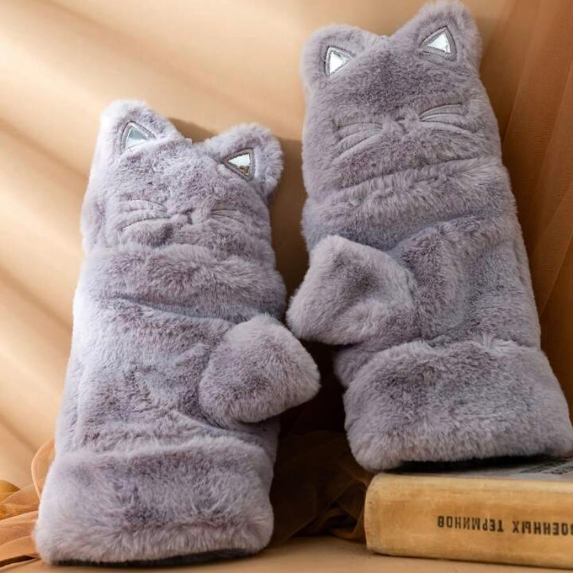 Get ready for the winter season with these soft plushie clamshell gloves with cute ears – the purr-fect blend of style and functionality! Crafted with soft, cozy materials, the clamshell style ensures a snug fit, providing extra warmth and preventing chilly drafts.  Embroidered details.