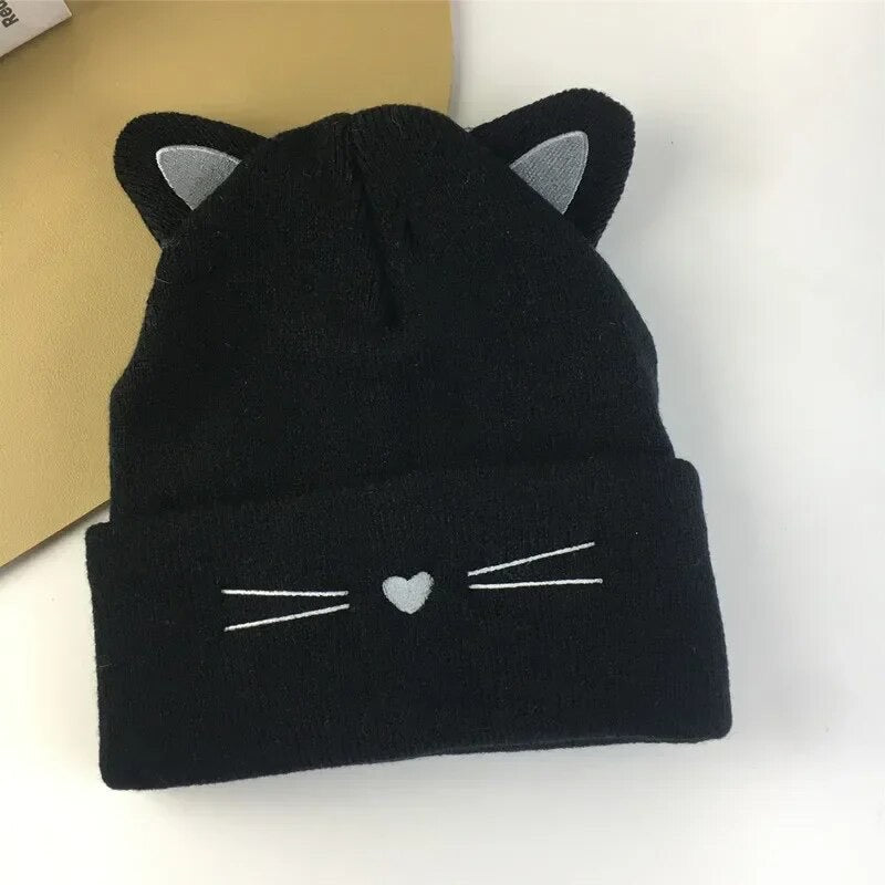 Cute, warm knitted hat with adorable embroidered ears, nose and whiskers – the purr-fect accessory for feline enthusiasts! Crafted from soft, high-quality materials, this hat combines comfort with charm. The irresistibly cute cat ears add a playful touch to your style, making it a delightful choice for any occasion. Stay cozy and chic with our kitty hat – because who says fashion can't be fun?