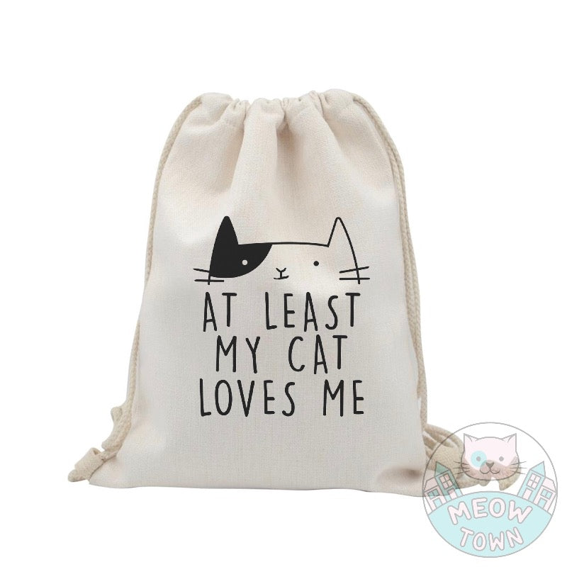 A lovely, funny tote bag printed in the UK by us at Meow Town, exclusively for You. 'At least my cat loves me’ slogan with a cute kitty print. Natural beige bag colour. Durable