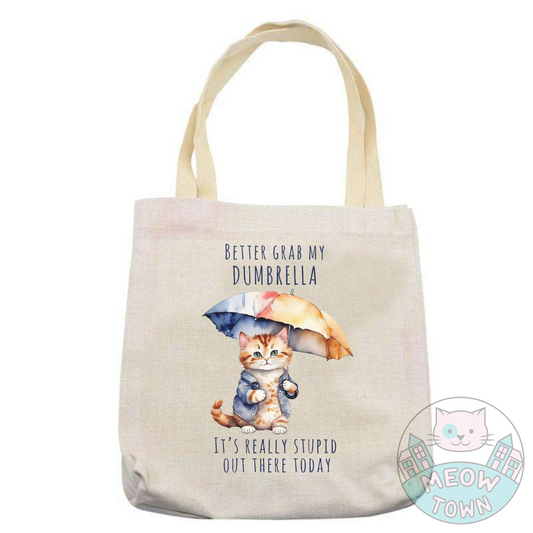 better grab my dumbrella it's really stupid out there today funny tote bag for cat lovers