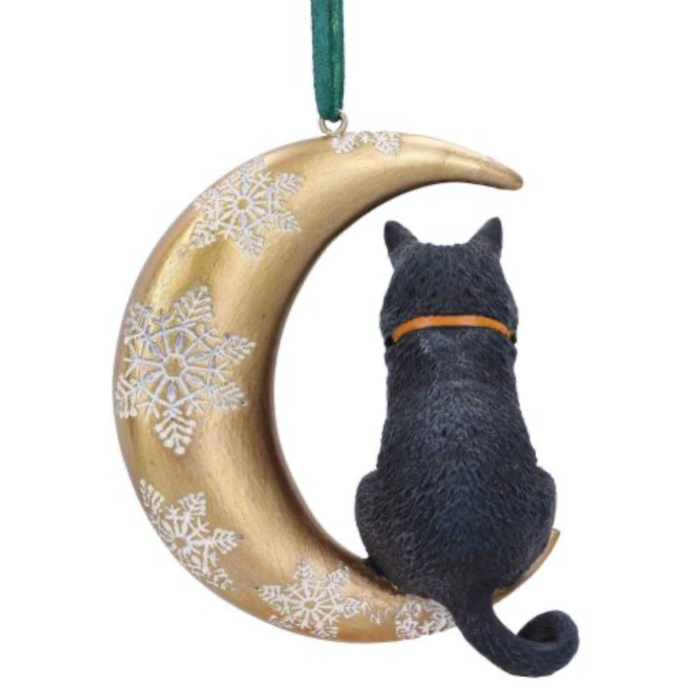 Black cat sitting on the Moon Christmas hanging ornament with white snowflakes.
