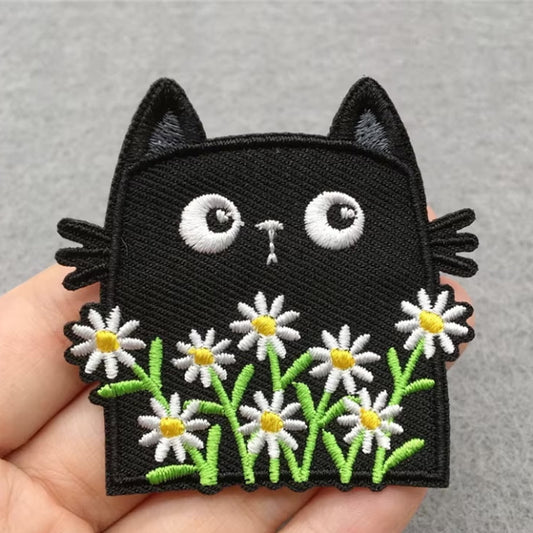 black cat with white flowers iron-on patch