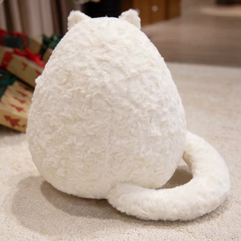 White plush cat toy on a carpeted floor