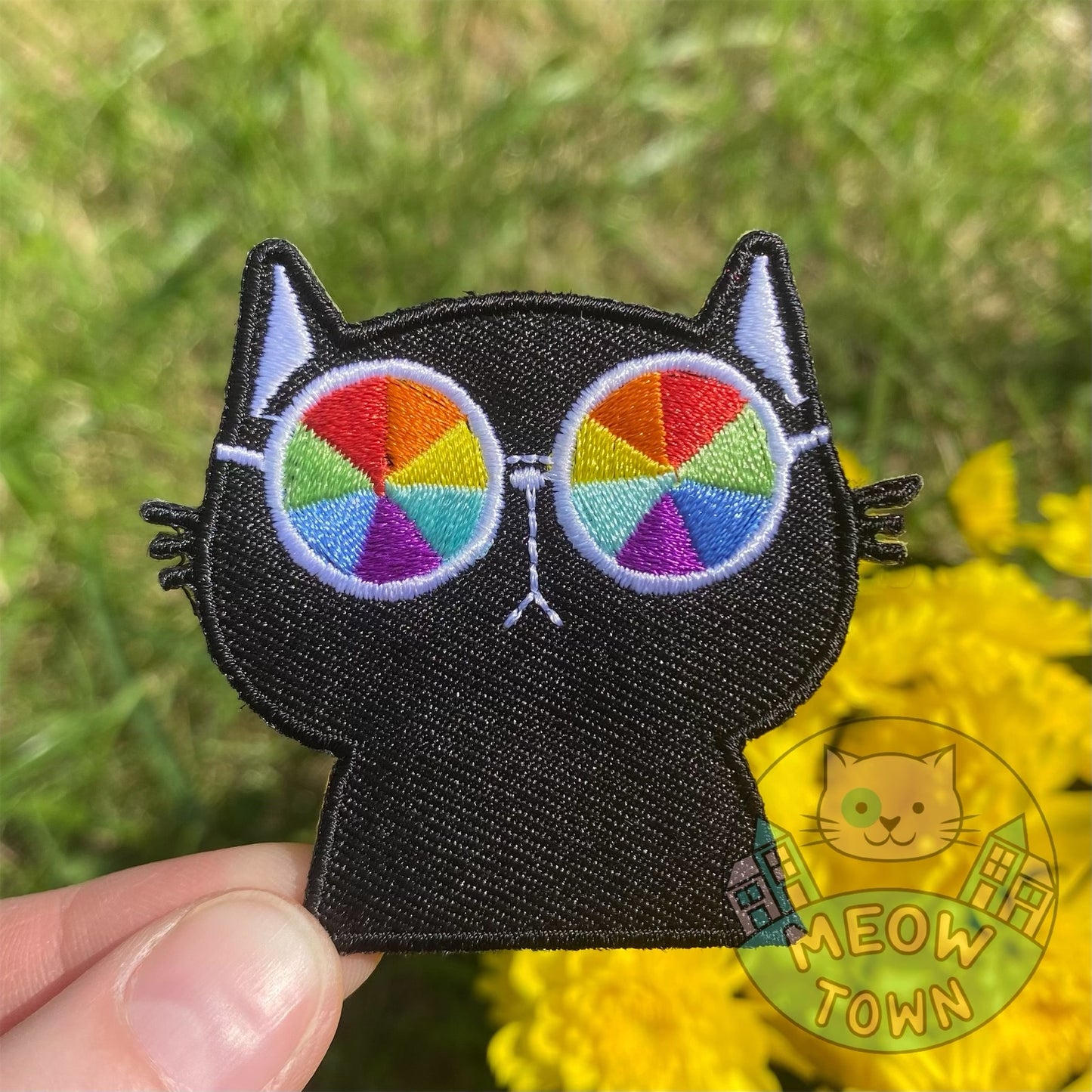 Cute embroidered iron-on patch with a black kitty with colourful sunglasses. A perfect way to bring new life to your old garments or to cover small holes or marks with this cute patch!