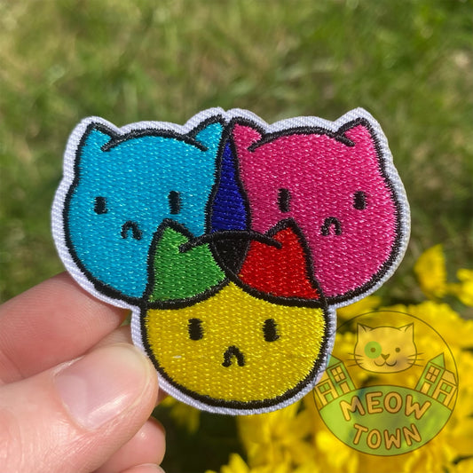 Cute embroidered iron-on patch with Cyan Magenta and Yellow colour kitties. A perfect way to bring new life to your old garments or to cover small holes or marks with this cute patch!
