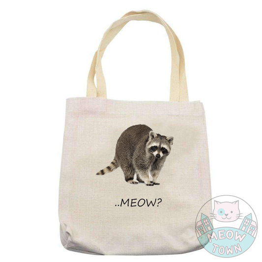 Funny and handy linen touch tote bag printed in the UK by us at Meow Town exclusively for You. 'Meow?’ slogan with a funny raccoon print. Natural beige bag colour. Durable single layer material. Polyester and cotton fabric, linen effect.  Choose from 3 bag types: Classic tote, Large tote or drawstring backpack.
