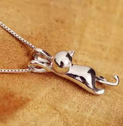 A lovely, small polished kitty shaped pendant with matching chain. Silver colour. Adorable cat necklace for cat lovers