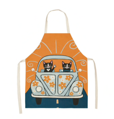 Tuxedo bicolor cats driving in the sunset in cute floral flower print car orange apron baking accessory for cat lovers
