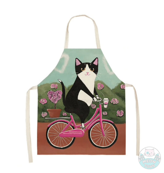 Cute cat kitten apron linen kitchen home accessories gift for cat lovers tuxedo black and white cat cycling pink picycle rose bushes