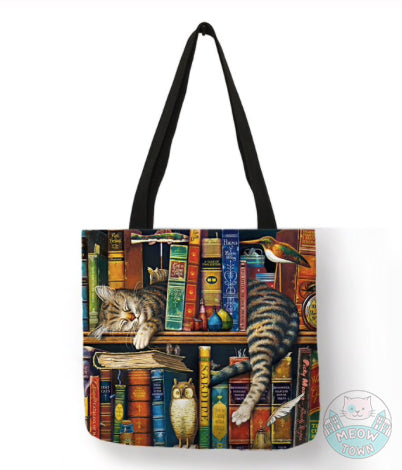 cat sleeping on bookshelf tote bag linen for cat lovers
