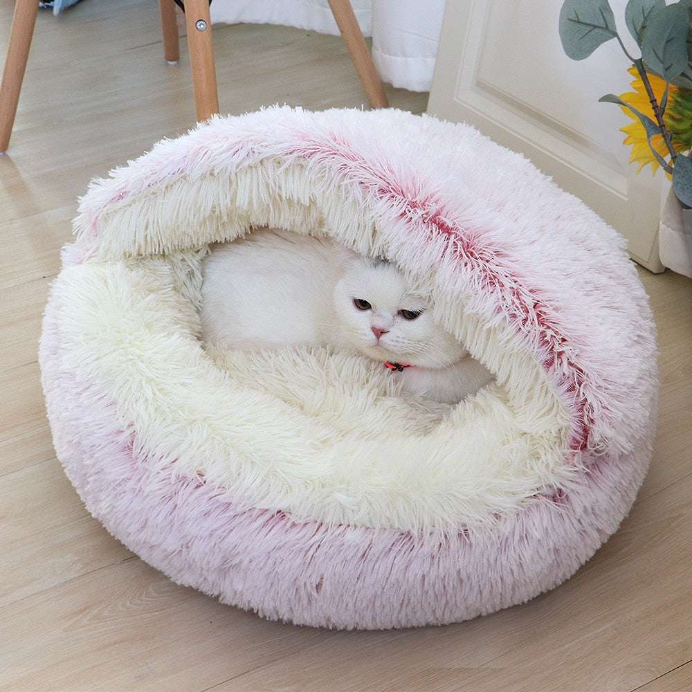All cats need their own little spaces to hide from time to time. This cosy fluffy bed is a purrfect gift for your furry friend. Super soft and warm. Non-slip bottom. Large size, perfectly enough room for kittens and adult cats as well. Material: Polyester and cotton, long pile plush.