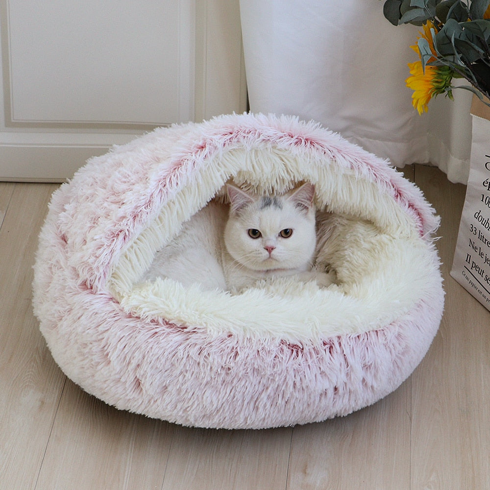 All cats need their own little spaces to hide from time to time. This cosy fluffy bed is a purrfect gift for your furry friend. Super soft and warm. Non-slip bottom. Large size, perfectly enough room for kittens and adult cats as well. Material: Polyester and cotton, long pile plush.