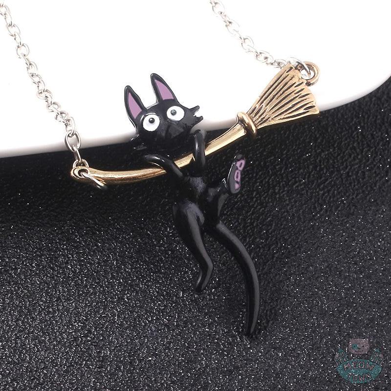black kitty hanging on the golden broom pendant on chain for cat kitten lovers