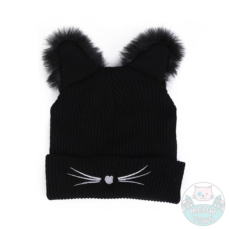 Cute, warm knitted hat with fluffy faux fur ears, specifically designed for the cat lover. Embroidered little nose and whiskers. Adults/teens size. Polyester, faux fur material. Suitable for autumn, winter and spring.