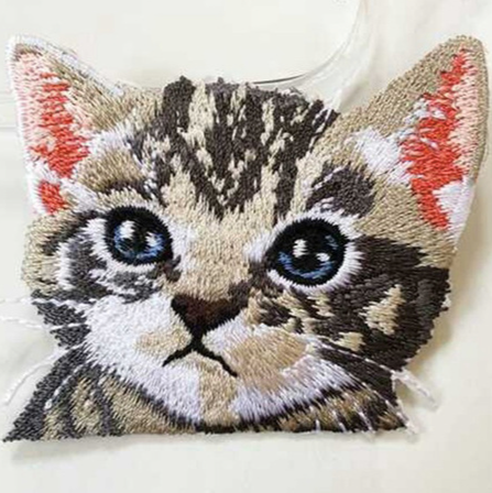 Adorable embroidered iron-on kitty patches in various designs.  A perfect way to bring new life to your old garments or cover small holes or marks with these cute kittens! Please choose required design from the drop-down menu. Glue is already applied to the back of the design, you can simply iron these patches on to the fabric 