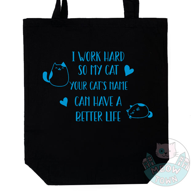 Meow Town Special, designed and printed in the UK by our team exclusively for You. Funny, 'I work hard so my cat can have a better life' slogan with ocean blue vinyl print. 100% cotton heavy duty black canvas tote bag. Durable single layer material, large capacity.