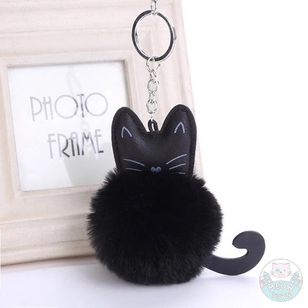 Faux fur ball keychain faux leather cat face print and cute tail for cat lovers. Pure black colour