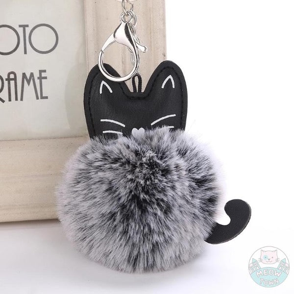 Faux fur ball keychain faux leather cat face print and cute tail for cat lovers. Black and white colour, gradient