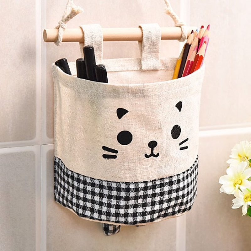 A super cute, small hanging storage bag with adorable printed kitty face to organise your everyday items in your kitchen, diy corner, office and so on. cat basket