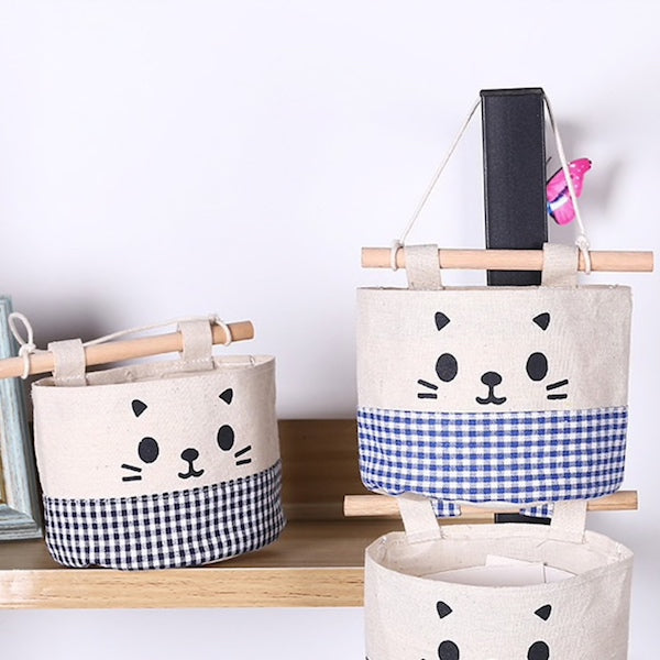 A super cute, small hanging storage bag with adorable printed kitty face to organise your everyday items in your kitchen, diy corner, office and so on. cat basket