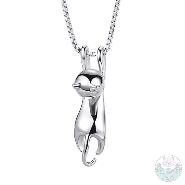 Cute hanging kitten pendant necklace for cat lovers. Silver colour polished jewellery