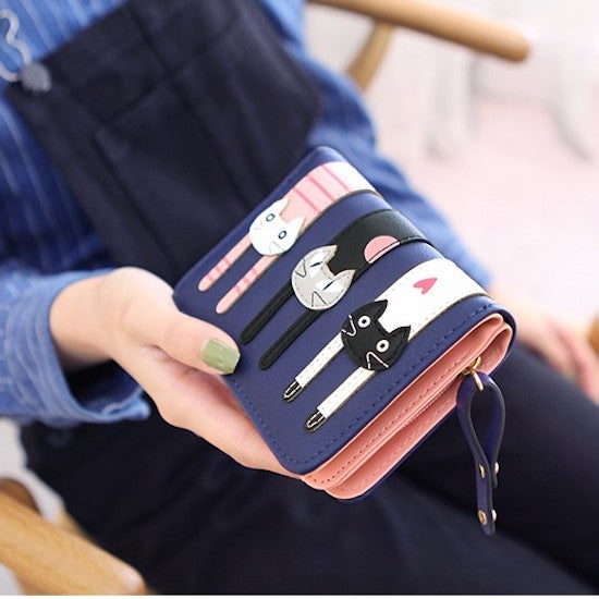 A beautiful and unique small purse with three adorable kitties. Features card holder sleeves and zip-around coin pocket. cat lovers kitten wallet