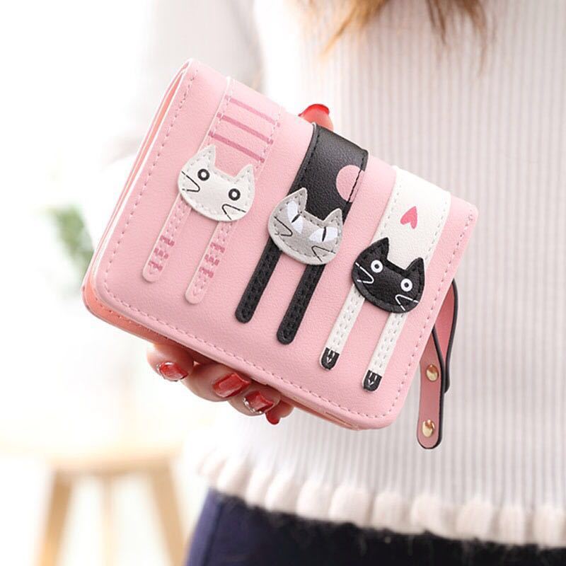 A beautiful and unique small purse with three adorable kitties. Features card holder sleeves and zip-around coin pocket. wallet for cat lovers